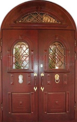 Стальная арочная дверь со стеклом и ковкой ДА-30 в дом из кирпича в Саратове